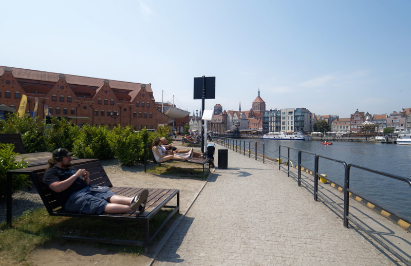 People relaxing on a waterfront in Gdansk